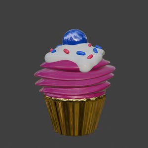 Puede incluir: Un cupcake rosa con glaseado blanco y chispas de colores. El cupcake est&aacute; cubierto con un caramelo azul y tiene una base de cupcake dorada.