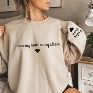 I Wear My Heart On My Sleeve Sweatshirt, Mothers Day Shirt, Mama Sweatshirt with Kids Name on Sleeve, Personalized Mother Day Gift for Mom