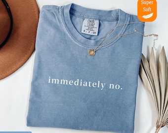 May include: A blue jean t-shirt with the text "immediately no." printed in white on the front. The shirt is made of a soft, comfortable fabric.