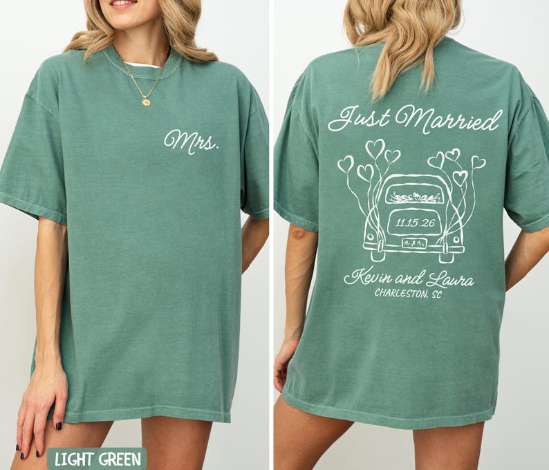 May include: Light green t-shirts with white text. One shirt says "Mrs." on the front. The other shirt says "Just Married" with a car graphic, date, and names on the back. The shirts are a relaxed fit.