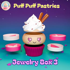 Puede incluir: Una original caja de joyería con forma de cupcake, con una cobertura de glaseado blanco y palitos de chocolate. La caja es beige con ojos en forma de corazón y una cara sonriente. La base es de color rosa intenso, con el texto "Jewelry Box 3".