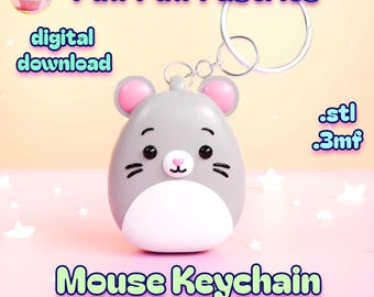 May include: A gray mouse-shaped keychain with pink ears and a white belly. The keychain has a silver ring and the text "Mouse Keychain" and "100% support-free" is displayed below the mouse. The background is pink.