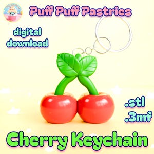 Puede incluir: Un llavero de cereza con dos cerezas rojas, tallos y hojas verdes. El llavero tiene un anillo plateado. Las palabras "Cherry Keychain" están en verde y amarillo. La imagen también incluye las palabras "digital download".