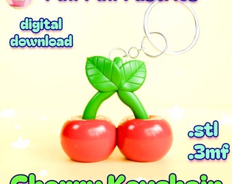 May include: A cherry keychain with two red cherries, green stems, and leaves. The keychain has a silver ring. The words "Cherry Keychain" are in green and yellow. The image also includes the words "digital download".