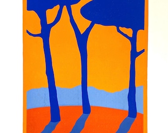 May include: A screen print titled gentle giants featuring three dark blue trees against a vibrant orange sky. The ground is a reddish-orange hue with long blue shadows cast by the trees. A light blue horizon line sits between the ground and sky.