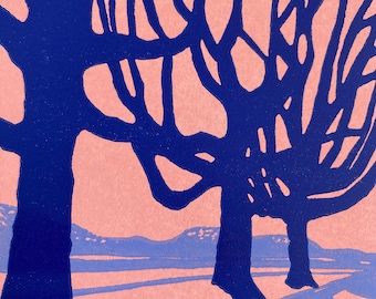 May include: A pink and blue abstract print of two trees with a landscape in the background. The trees are stylized and have a dark blue outline. The landscape is a light blue color.