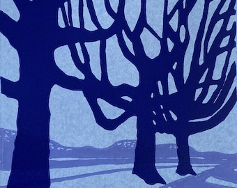 May include: A blue and white abstract print of two trees with bare branches against a light blue background.