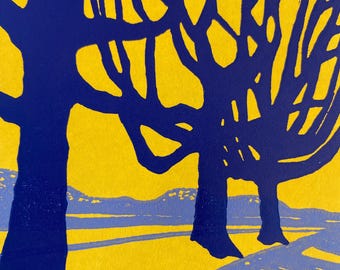 May include: A digital art print featuring two stylized trees with dark blue branches against a bright yellow background. The trees are silhouetted against a light blue landscape with a light blue path in the foreground.