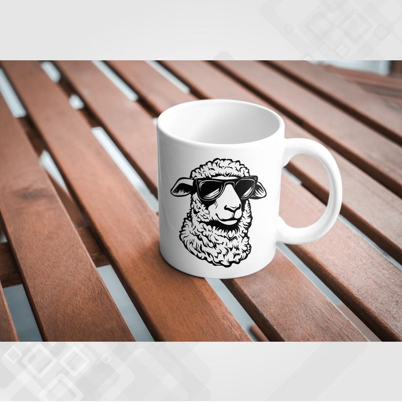 May include: White ceramic mug with a black and white illustration of a sheep wearing sunglasses. The sheep is looking to the right.