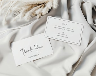 May include: Two white thank you cards with black text. The top card has a discount code and website address. The bottom card says "Thank You" and "BUSINESS NAME".