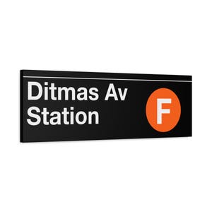 May include: Black and white sign with the text "Ditmas Av Station" in white lettering. A white "F" is in a red circle on the right side of the sign.