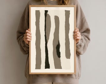 Könnte beinhalten: Ein rechteckiger gerahmter Kunstdruck mit einer Reihe vertikaler, abstrakter Pinselstriche in verschiedenen Nuancen von Taupe, Beige und Schwarz auf cremefarbenem Hintergrund. Das Kunstwerk befindet sich in einem hellen Holzrahmen.