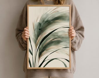 Könnte beinhalten: Ein rechteckiger gerahmter Wandkunstdruck mit einer abstrakten Aquarellillustration von hohen, schlanken Grashalmen in Schattierungen von Salbeigrün, dunklem Waldgrün und sanftem Beige auf einem hellcremefarbenen Hintergrund.