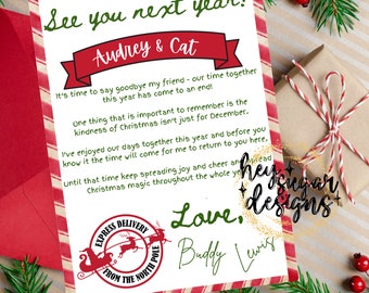 May include: A red and white striped card with a handwritten message that says "See you next year! Audrey & Cat" and "Love, Buddy Lewis". The card also features a red and white striped candy cane design and a small image of a sleigh with reindeer.