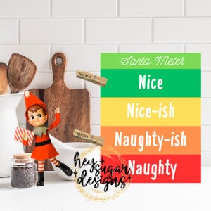 May include: A Christmas-themed Santa Meter sign with levels of "Nice" to "Naughty". An elf figurine stands beside the sign, with clothespins labeled "Natalie" and "Micah". The sign is green, yellow, orange, and red.