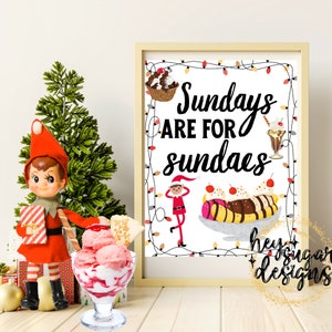May include: A printable sign with the text "Sundays are for sundaes" in black lettering on a white background. The sign is surrounded by a border of red and white Christmas lights. There is a cartoon elf in the bottom left corner and a cartoon banana split in the bottom right corner.