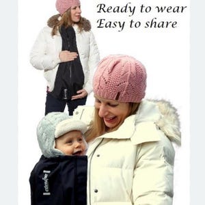 L'estensione del cappotto premaman si trasforma in una copertura per il trasporto dei bambini