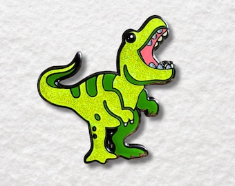 Épingle en émail T-Rex scintillant - Dinosaure vert et jaune avec gril glacé