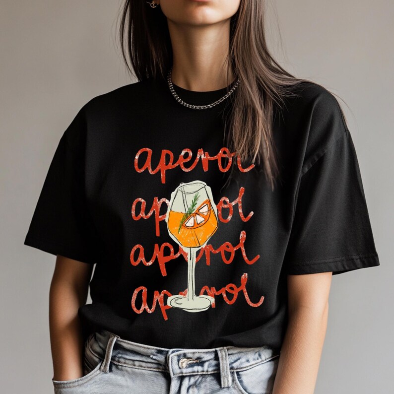May include: Black t-shirt with a red graphic of an Aperol Spritz cocktail. The text "aperol" is repeated four times in a distressed font.