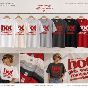 May include: A collection of Gildan 5000 unisex t-shirts in white, natural, ash, sport grey, charcoal, black, and red. Each shirt features the red text 'hot girls watch FORMULA 1' and a race car graphic. The display includes hanging shirts and views of the shirts being worn.