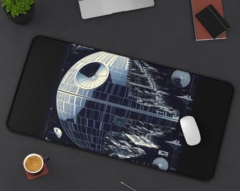May include: Black rectangular desk mat featuring a detailed illustration of the Death Star space station. The design is in shades of blue and white, with intricate architectural details. A white computer mouse rests on the mat.