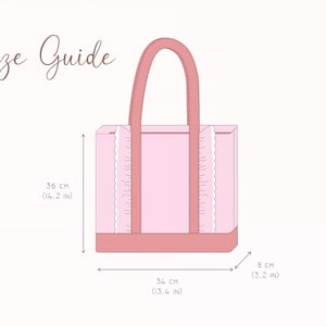 May include: A light pink tote bag with dark pink handles and a dark pink base, featuring white ruffled trim along the vertical seams. The text Size Guide is displayed above. Dimensions are 36 cm (14.2 in) high, 34 cm (13.4 in) wide, and 8 cm (3.2 in) deep.