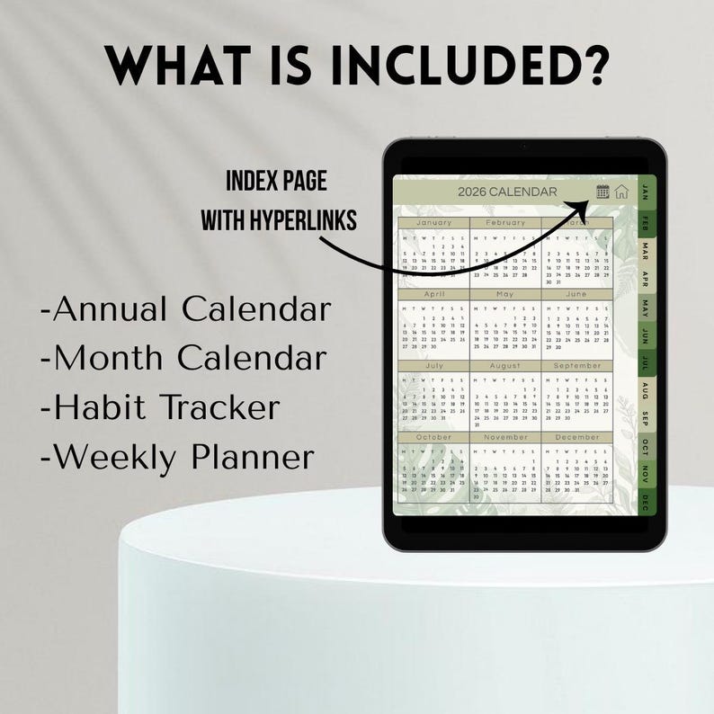 May include: A digital planner on a black tablet displays a 2026 calendar with a green and white floral design. The screen shows the months of the year. Text on the screen reads "What is Included?" and lists features like an annual calendar, month calendar, habit tracker, and weekly planner.