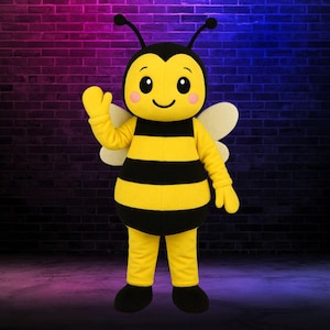 May include: A full-body bee costume with a yellow and black striped torso, yellow arms and legs, and black feet. The bee has a smiling face with rosy cheeks, large eyes, and antennae. The costume includes white wings and is set against a brick wall.