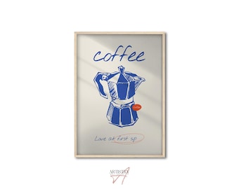 May include: A framed print featuring a blue sketch of a stovetop espresso maker. The word "coffee" is written above the image, with "Love at first sip" below. The print has a light beige background and a wooden frame.