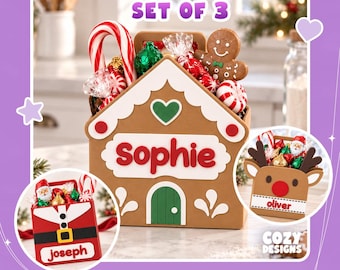 May include: A set of three digital 3D print files for holiday treat containers. One container is a gingerbread house labeled Sophie, one is a Santa suit labeled Joseph, and one is a reindeer labeled oliver. Each holds assorted holiday candies.