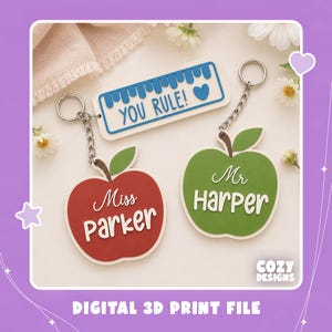 May include: Two apple-shaped keychains and one rectangular ruler-shaped keychain. The red apple says Miss Parker, the green apple says Mr. Harper, and the white ruler features blue text that reads YOU RULE! with a small blue heart icon.