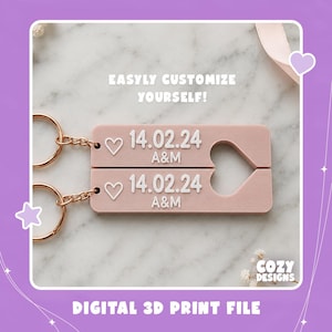 May include: Two rectangular dusty pink keychains with rose gold rings. Each features a white heart icon, the date 14.02.24, and the letters A&M. The text "EASYLY CUSTOMIZE YOURSELF!" and "DIGITAL 3D PRINT FILE" appear on the image along with "COZY DESIGNS".