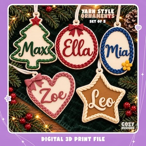 May include: A set of five hanging ornaments featuring yarn-style borders and personalized names. The shapes include a tree with Max, a circle with Ella, an oval with Mia, a heart with Zoe, and a star with Leo. Text reads YARN STYLE ORNAMENTS SET OF 5.