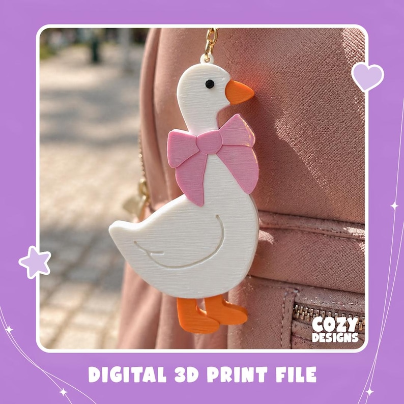 May include: A white 3D printed goose keychain with an orange beak and feet, wearing a pink bow around its neck. The keychain is attached to a pink bag. The text "COZY DESIGNS" and "DIGITAL 3D PRINT FILE" are visible in the image.