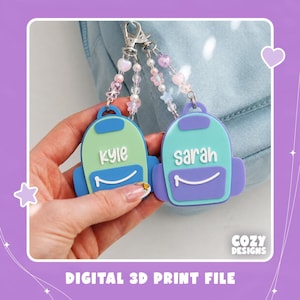 May include: Two backpack-shaped keychains with beaded attachments. One is light green with the name Kyle, the other is teal and purple with the name Sarah. Both feature white lettering and a white zipper line. The text Cozy Designs Digital 3D Print File is visible.