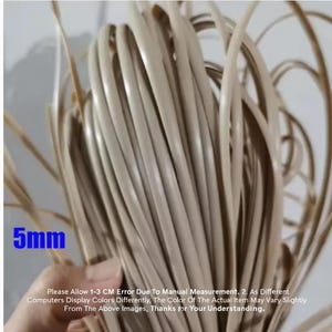 May include: Close-up of a bundle of beige-colored, flat rattan strips, each approximately 5mm wide. The image includes text indicating a measurement of 5mm and a disclaimer about color variations and measurement errors.