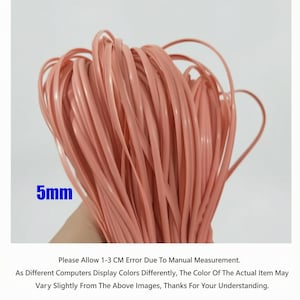 May include: A bundle of light pink, flat, 5mm wide, plastic cord. The cord is tightly coiled, with some strands extending outwards. The image includes text that says "5mm".