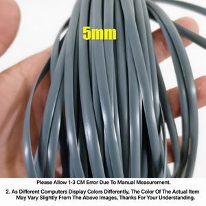 May include: A bundle of gray, flexible plastic tubing, approximately 5mm in diameter, is held in a hand. The text "5mm" is displayed in yellow. The image also contains text regarding measurement error and color variations.