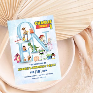May include: A light blue birthday party invitation featuring the text "CHARLIE STORY 1". The invitation includes the text "YOU'RE INVITED TO CHARLIE'S BIRTHDAY PARTY" and the date "FEB 18 3PM". The invitation is decorated with cartoon characters.