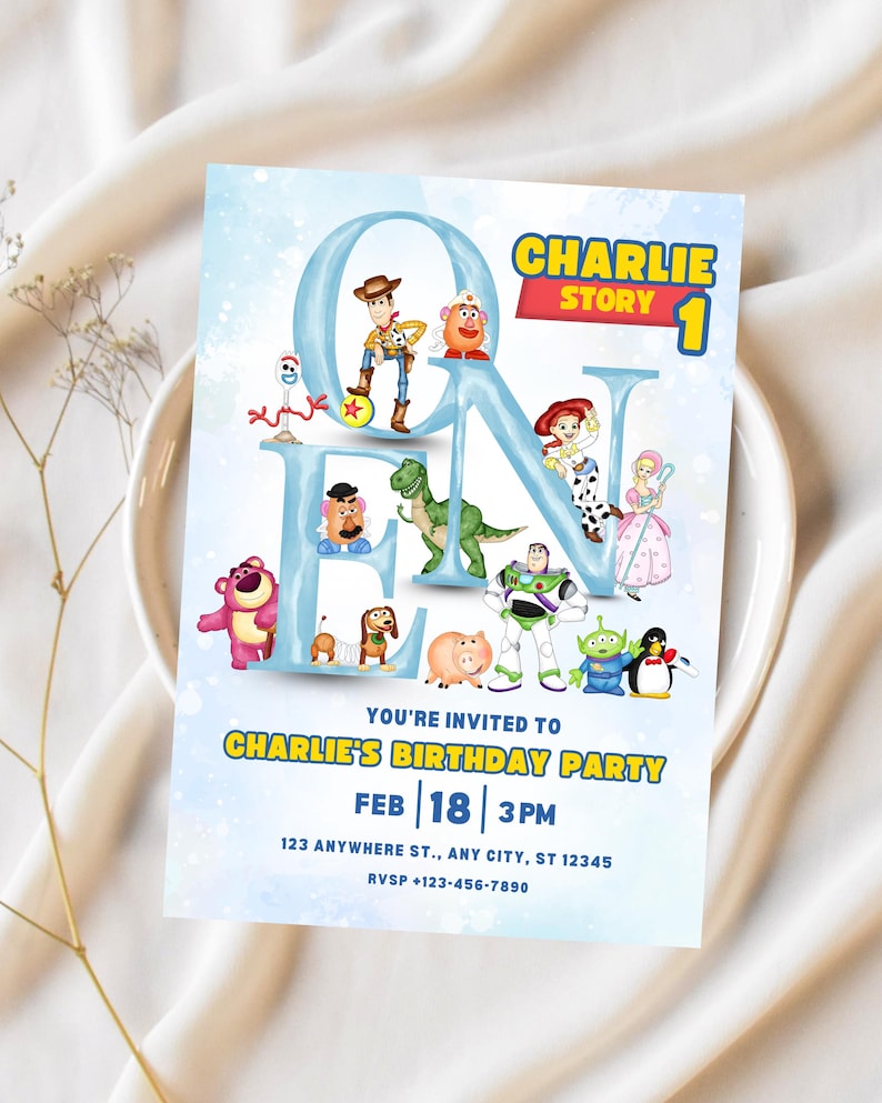 May include: A light blue birthday party invitation featuring characters from the movie "Toy Story." The invitation reads "Charlie Story 1" and includes the party details: date, time, and location. The invitation is decorated with various cartoon characters.