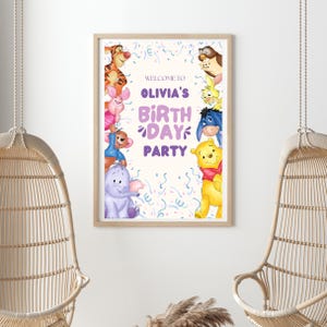 May include: A Winnie the Pooh themed birthday party sign with a purple and white background. The sign says "Welcome to Olivia's Birthday Party" and features characters like Winnie the Pooh, Piglet, Eeyore, Tigger, and Owl.