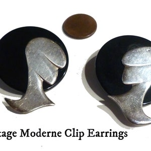 Moderne Earrings. Clip Ons. Vintage Circa 1980s. About 2&quot; Long. Black Resin with Silver Metal. Very Well Made. Not Marked.