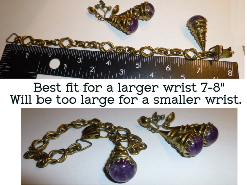 May include: A gold chain bracelet with a purple stone pendant and matching clip-on earrings. The bracelet measures 7-8 inches and is too large for a smaller wrist.
