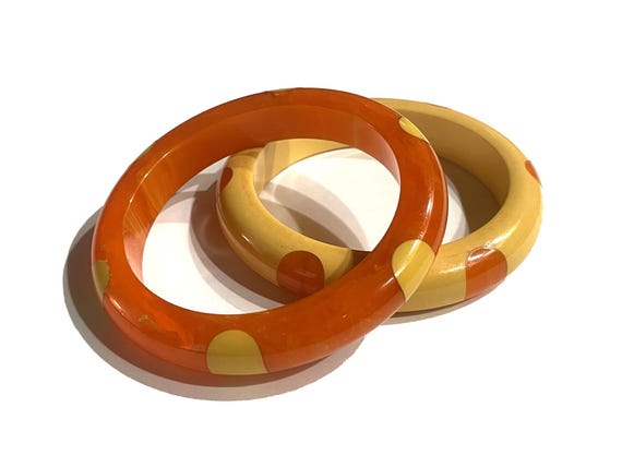 Pair of Bakelite Polka Dot Bangles. Orange and Yellow Six