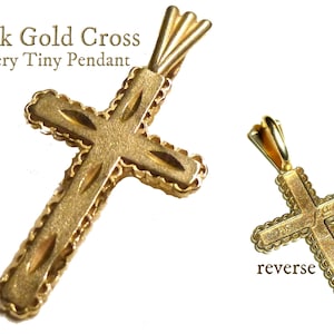 14k Gold Cross Pendant. Marked 14k and MA for Michael Anthony Jewelers. Circa 1980s. VERY TINY One Inch Long. Weighs less than a Gram.