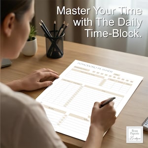 May include: A Pomodoro planner with the text "Master Your Time with The Daily Time-Block." The planner has sections for tasks, goals, and notes. The planner is on a wooden desk with a pen and pencils.