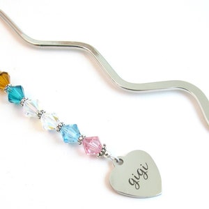 Custom Birthstone Bookmark:  Each Swarovski 8mm crystal represents a grandchild or child's birthstone (up to 9 crystals). Choose one charm.  They are attached to a 6" silver plated bookmark.