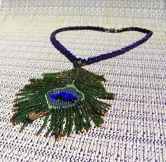 Items similar to Bead woven Peacock Feather Necklace on Etsy