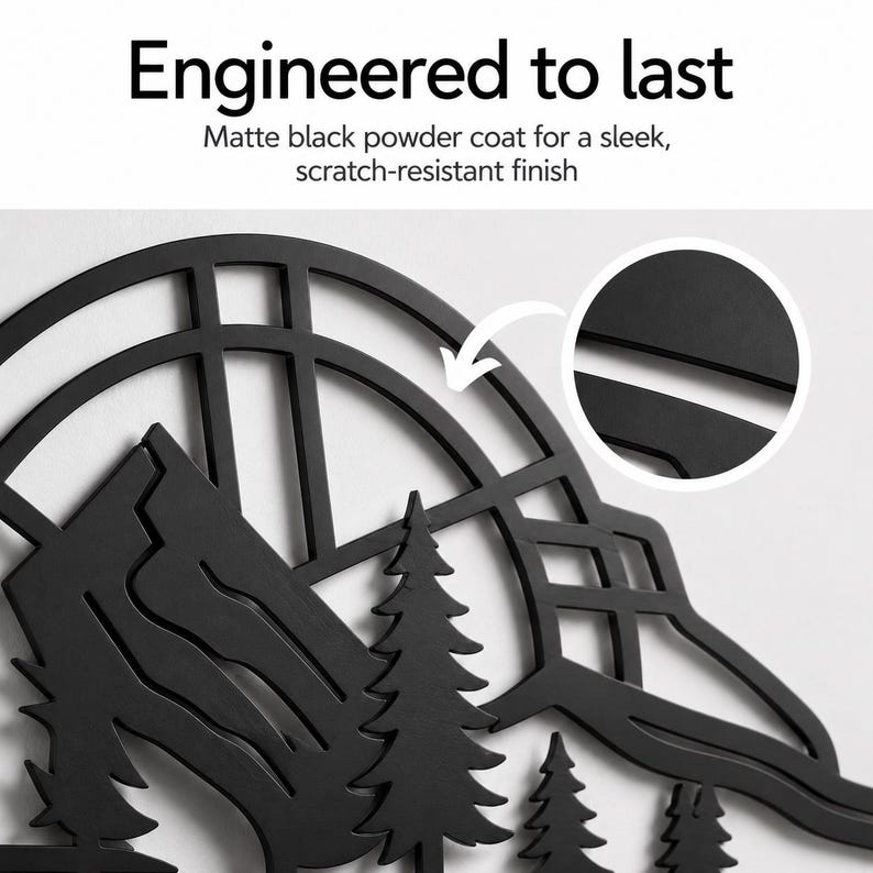 May include: A matte black metal wall art piece featuring a mountain and pine tree silhouette within a circular frame. The text reads Engineered to last, Matte black powder coat for a sleek, scratch-resistant finish. A circular inset shows detail.