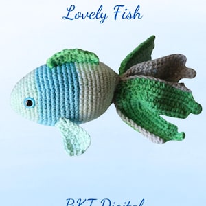 May include: A crocheted green, blue, and gray fish toy with the text "Lovely Fish" above it and "BKT Digital" below it.
